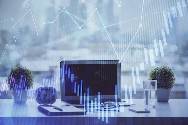 forex chart hologram on table with computer background multi exposure concept of financial markets