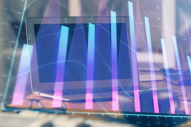 Forex Chart hologram on table with computer background Multi exposure Concept of financial markets