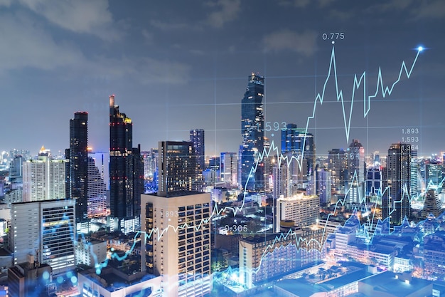 FOREX grafiek hologram luchtfoto nacht panoramisch stadsgezicht van Bangkok de ontwikkelde locatie voor beursonderzoekers in Zuidoost-Azië Het concept van fundamentele analyse Dubbele blootstelling