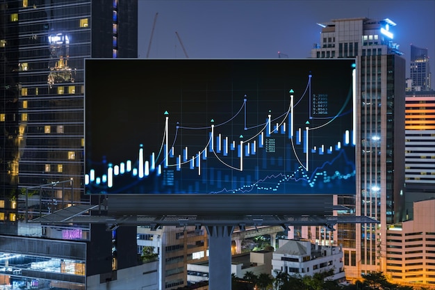 Forex graph hologram on billboard aerial night panoramic\
cityscape of bangkok the developed location for stock market\
researchers in southeast asia the concept of fundamental\
analysis
