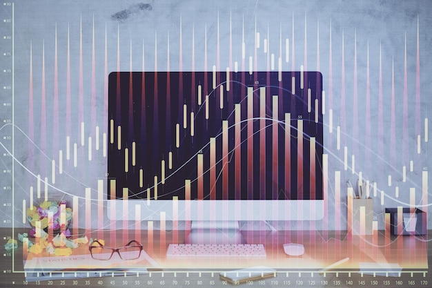 Forex graph hologram on table with computer background Double exposure Concept of financial markets