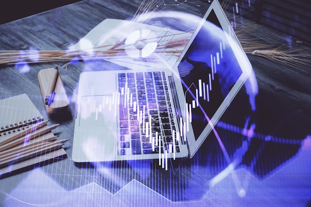 Forex market graph hologram and personal computer on background Double exposure Concept of investment