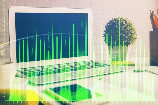 Photo forex market graph hologram and personal computer on background double exposure concept of investment