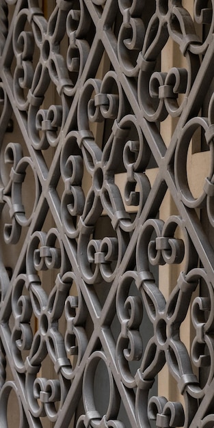 Forged metal protective grille on an old window Metal pattern building for safety