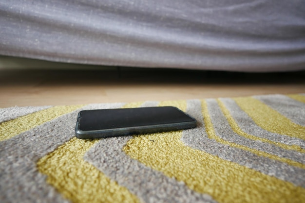 Forget smartphone on floor at home