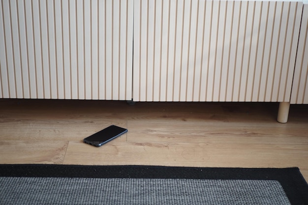 Forget smartphone on floor at home