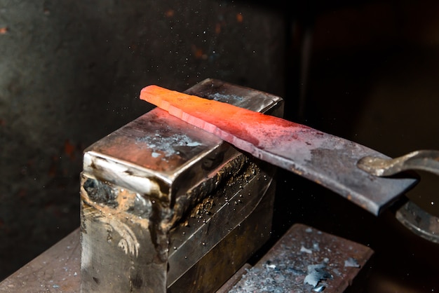 Forging molten metal. Making knives.