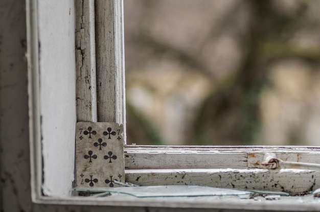 Forgotten playing card on window