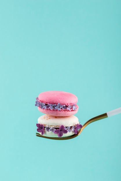 Fork holding macarons with flowers