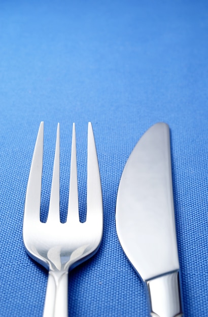 Fork and knife on a blue napkin