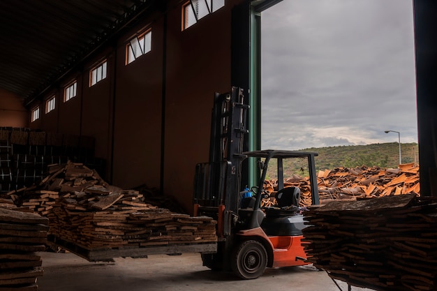 Fork lifter moving cork planks