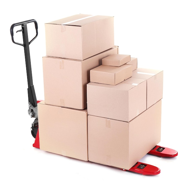 Photo fork pallet truck with stack of cardboard boxes isolated on white