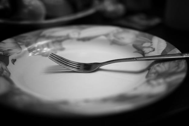 Fork in plate black white