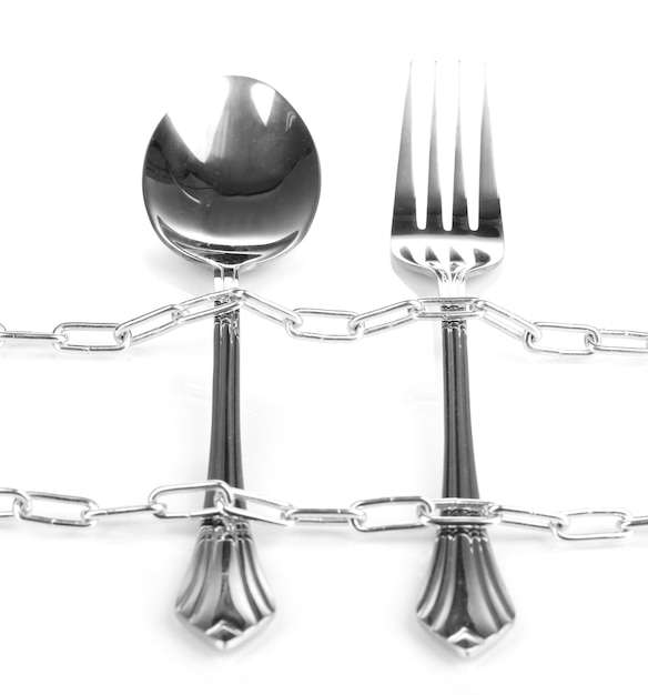 Fork and spoon with chain isolated on white