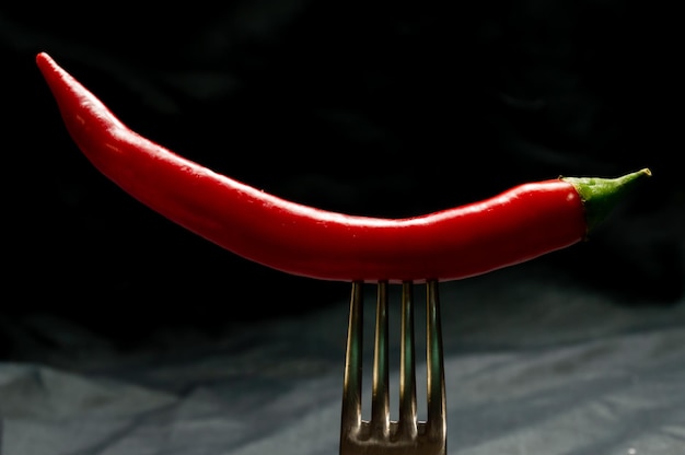 Fork with chili peppers on it