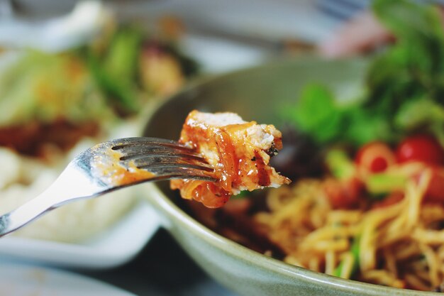 fork with meat grill and food background