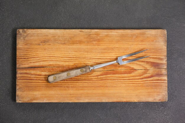 Photo fork on wooden board
