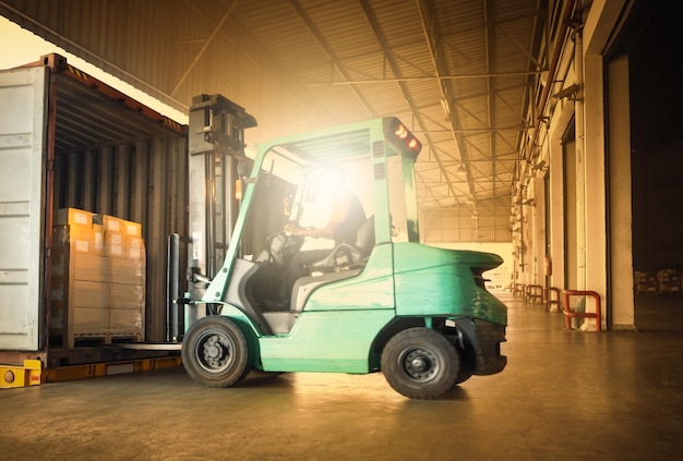 Forklift Tractor Loading Package Boxes into Container Cargo Shipping Supply Chain Goods Logistics