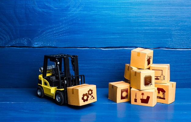 Forklift truck and cardboard boxes with goods Logistic infrastructure and warehousing services