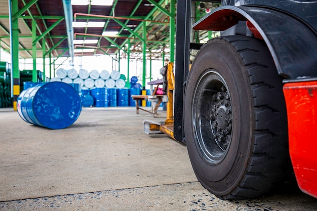 Forklift wheel lifts chemical drums oil barrels blue chemical drums horizontal stacked