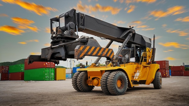 Forklift working in the container cargo yard port loading cargo
tank logistic service and transportation concept forwarder
mast