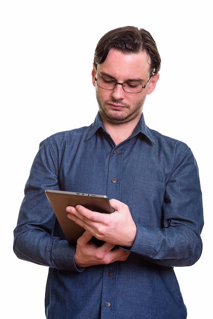 formal young man wearing eyeglasses using digital tablet