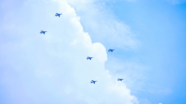 Photo formation of planes flying in the distant sky, blue sky, japan