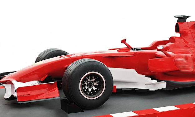 Foto formel 1 un'auto rossa veloce isolata su sfondo bianco in studio che rappresenta il concetto di potenza e velocità