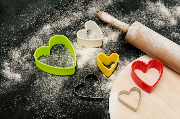 Forms for baking cookies of hearts. Preparation of treats for valentine day