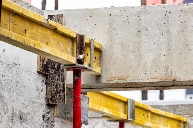 Formwork for pouring the second floor of a monolithic building Reinforcement of walls and ceiling Monolithic work during the construction of a building closeup Construction technologies