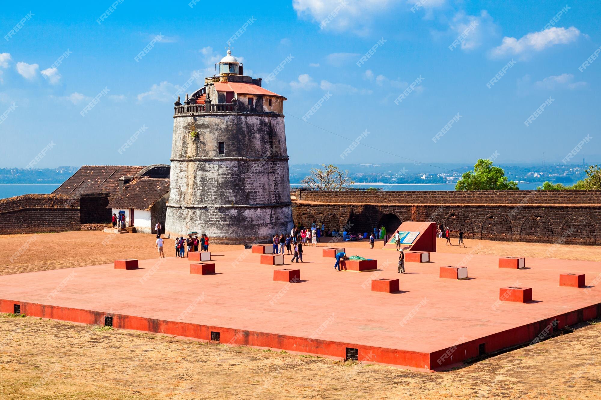 Premium Photo | Fort aguada and its lighthouse is a portuguese fort  standing on sinquerim beach in goa, india