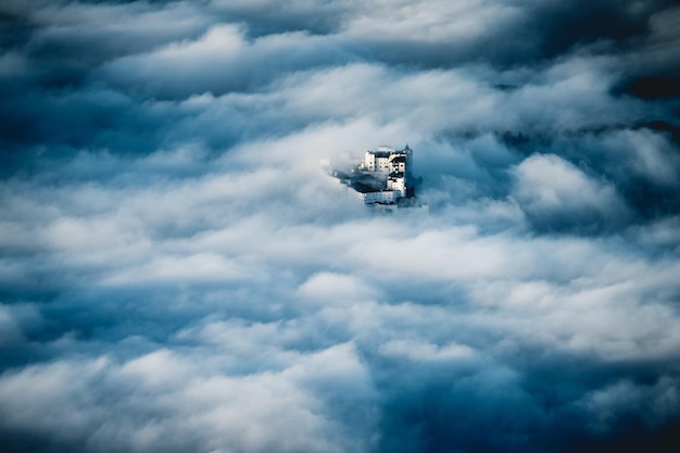 fortress hohensalzburg rising above a sea of clouds salzburg austria