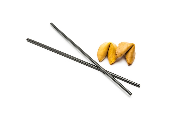 Fortune cookies with black chopsticks