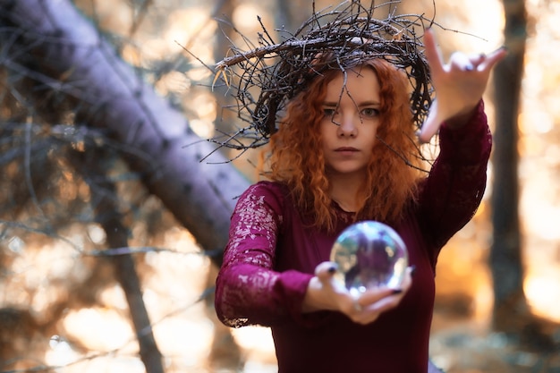 Fortune-teller conducts a ritual in the depths of the forest