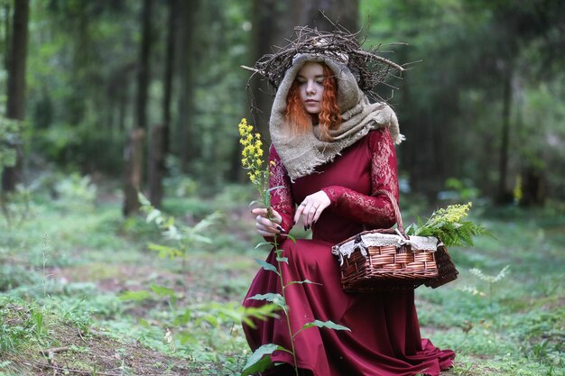 Fortune-teller conducts a ritual in the depths of the forest