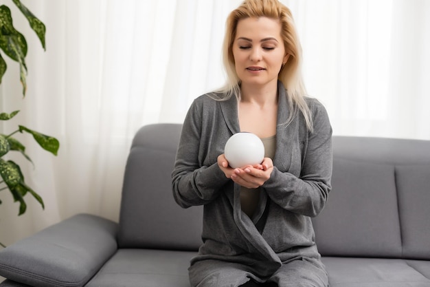 A fortune teller gazes into her ball.