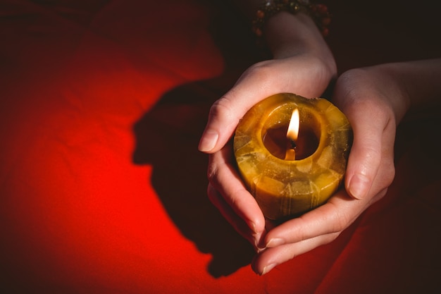 Photo fortune teller holding a candle