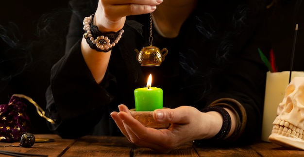 Fortune-teller or oracle with objects for fortune-telling during the session