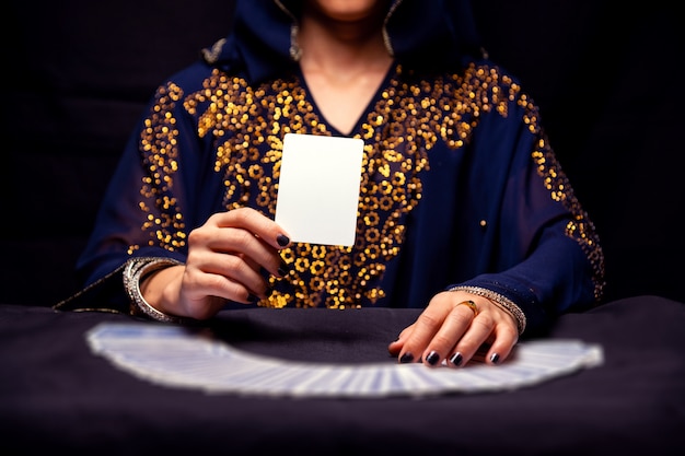 Photo fortune teller's hands and tarot cards