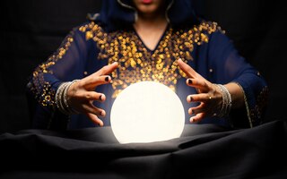 Fortune teller's hands with crystal ball