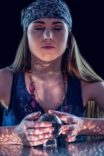 Fortune teller using crystal ball