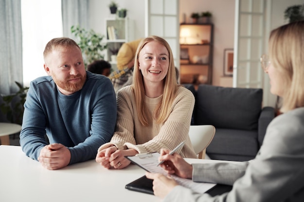 Photo foster couple being interviewed by social worker