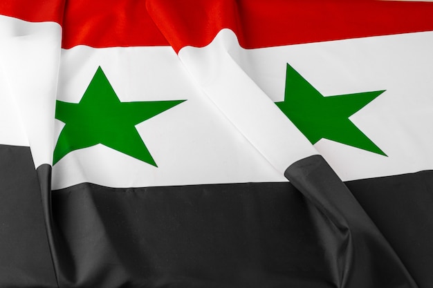 Foto van de vlag dichte omhooggaand van stoffensyrië