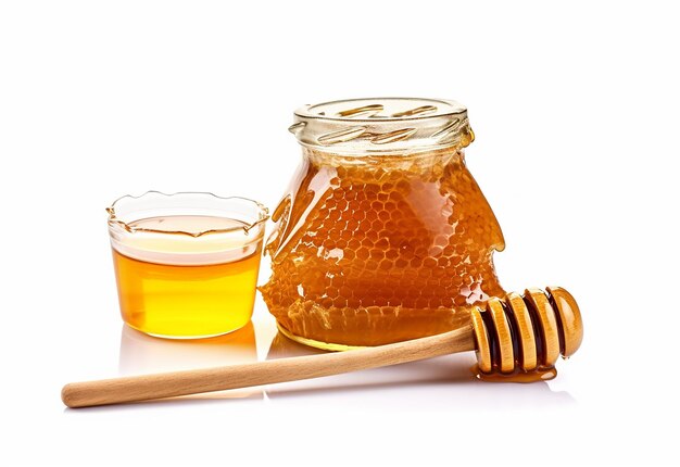 Foto van verse bijenhoningraten met honingflessen