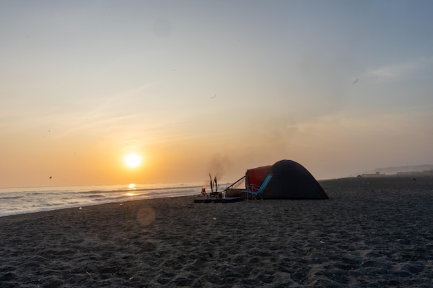 Fotoboek van de zonsondergang op het strand van Peru