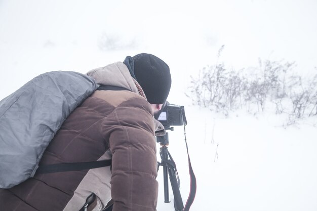 Fotograaf in de winter. Winter. Besneeuwde dag