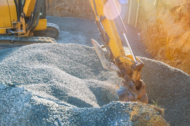 Foundation of the house moving gravel excavator in the construction works