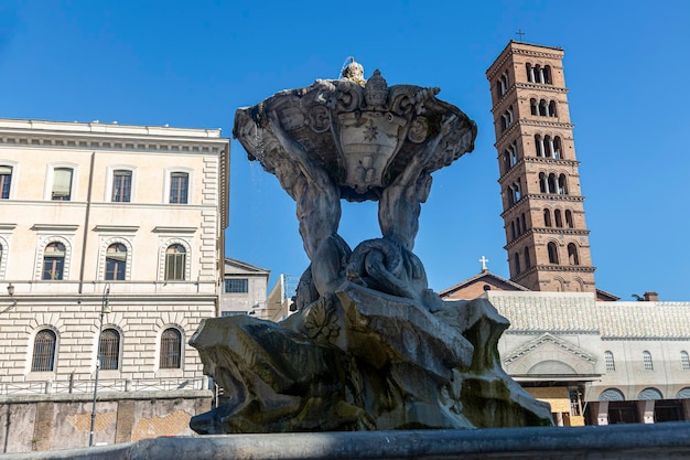 Photo a fountain in the courtyard of rome