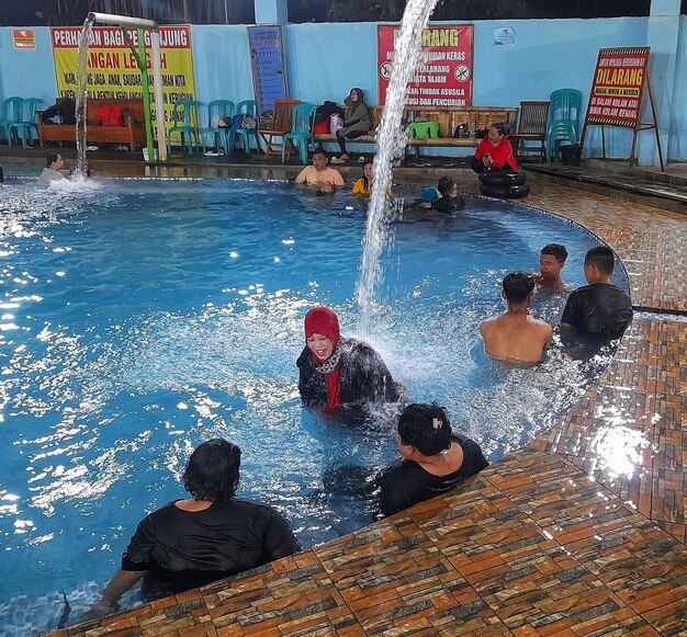 A fountain from a pipe in a swimming pool