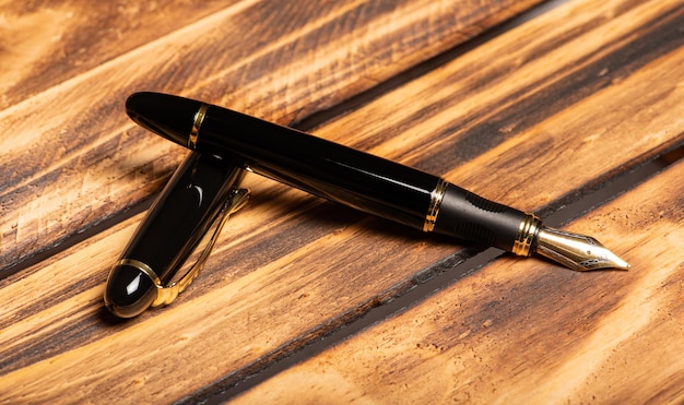 Fountain pen beautiful fountain pen on a rustic wooden surface selective focus